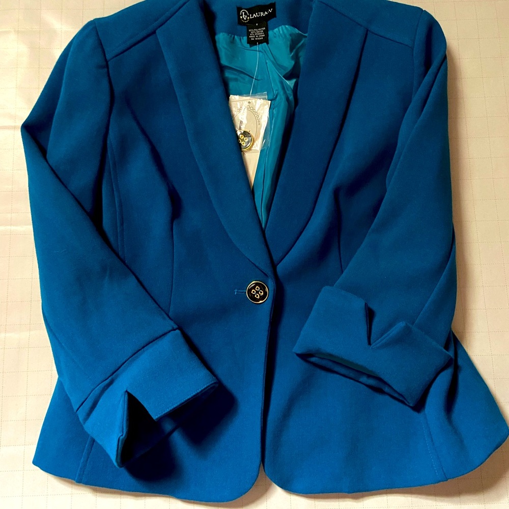 Blue medium sized blazer. Extra shoulder padding. 3/4 length sleeve